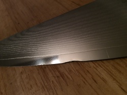 Bingao - ding or chip on a blade.jpg
